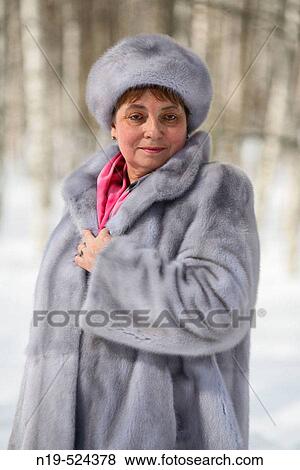 Stock Photo - Middle aged woman in fur at winter, Russia. Fotosearch