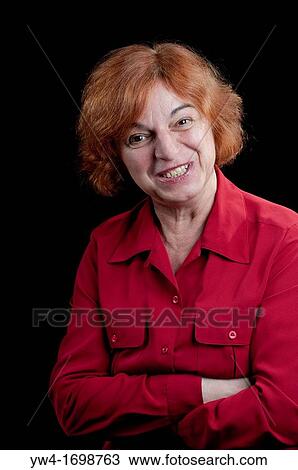 Middle aged woman looking falsly friendly View Large Photo Image Stock Image - Middle aged woman looking falsly friendly. Fotosearch