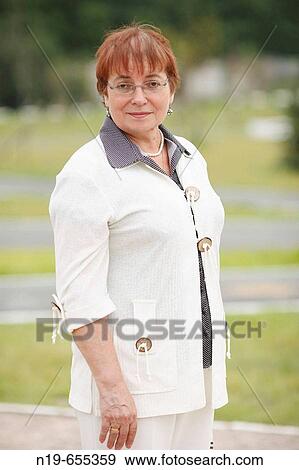 Middle aged woman outdoors View Large Photo Image Stock Photo - Middle aged woman outdoors. Fotosearch