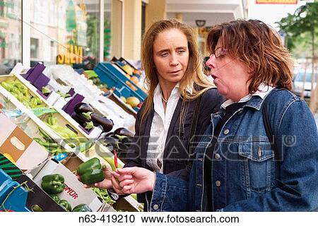Middle aged woman surprised at the hot taste of a hot red chilli View Large Photo Image Stock Image - Middle aged woman surprised at the hot taste of a hot red chilli. Fotosearch