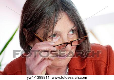 Middle aged woman with glasses View Large Photo Image Stock Image - Middle aged woman with glasses. Fotosearch