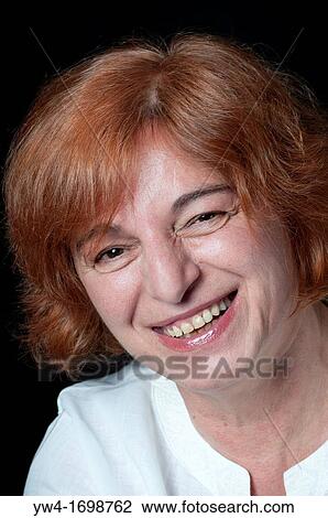 Middle aged woman with red hair looking happy View Large Photo Image Stock Image - Middle aged woman with red hair looking happy. Fotosearch