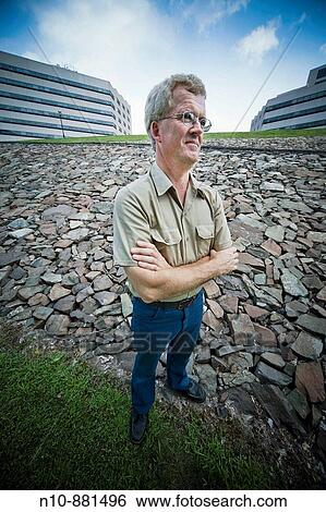 Middle_age man, wearing glasses, posing. View Large Photo Image Stock Photograph - Middle_age man, wearing glasses, posing.. Fotosearch