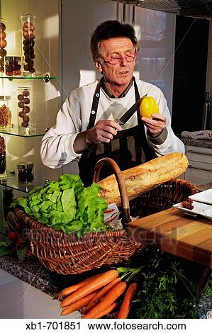 Middleaged man is cooking View Large Photo Image Stock Image - Middleaged man is cooking. Fotosearch