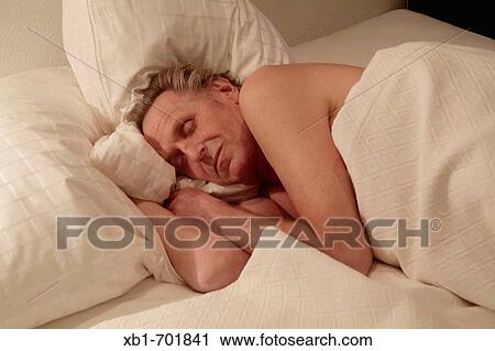 Middleaged man is sleeping View Large Photo Image Stock Image - Middleaged man is sleeping. Fotosearch