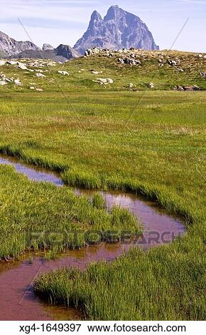 Stock Photo - Midi d? Ossau Peak from the lakes Anayet - Pyrenees - Aragon Pyrenees - Huesca - Aragon - Spain - Europe. Fotosearch