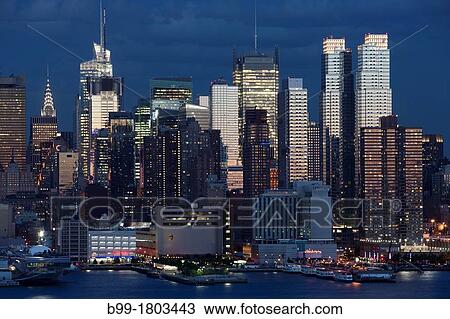 Stock Image - MIDTOWN SKYLINE HUDSON RIVER MANHATTAN NEW YORK CITY USA. Fotosearch