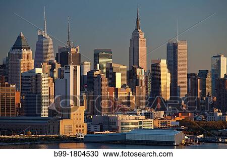 Stock Image - MIDTOWN SKYLINE HUDSON RIVER MANHATTAN NEW YORK CITY USA. Fotosearch