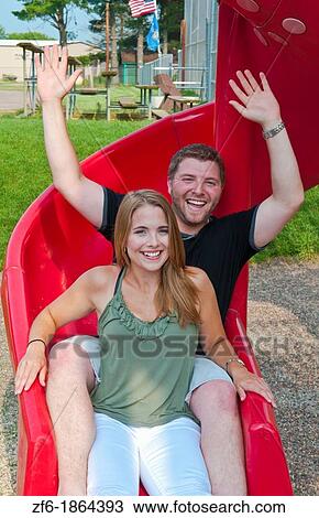 Midwest couple aged 22 playing and dating in park at monkey bars and hugging playing View Large Photo Image Stock Image - Midwest couple aged 22 playing and dating in park at monkey bars and hugging playing. Fotosearch