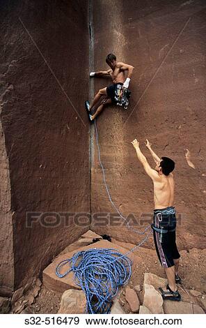 Stock Photo - Mikel SilvBn and Roberto Largo climbing? Amaretto Corner? (L1 5. 9). Indian Creek. Utah. USA. Fotosearch
