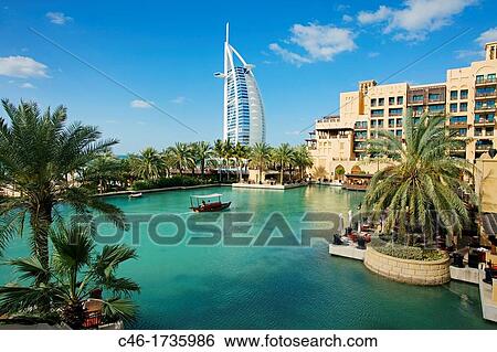 Mina a Salam Madinat Jumeirah hotel, on the background Burj Al Arab hotel, Dubai City, Dubai, United Arab Emirates, Middle East. View Large Photo Image Stock Photograph - Mina a Salam Madinat Jumeirah hotel, on the background Burj Al Arab hotel, Dubai City, Dubai, United Arab Emirates, Middle East.. Fotosearch
