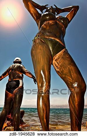 Mineral-rich mud of the Holy Land in dead sea. View Large Photo Image Stock Photo - Mineral-rich mud of the Holy Land in dead sea.. Fotosearch
