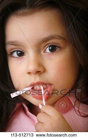 Minor girl portrait grimacing and with chewed plastic straw in her mouth View Large Photo Image Stock Image - Minor girl portrait grimacing and with chewed plastic straw in her mouth. Fotosearch