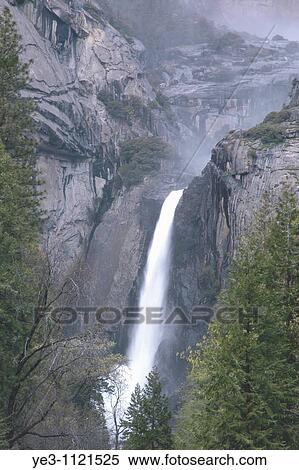 Mist rises above a small waterfall in Yosemite View Large Photo Image Stock Photography - Mist rises above a small waterfall in Yosemite. Fotosearch