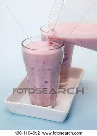 Mixed Berry Smoothie isolated against a blue background View Large Photo Image Stock Image - Mixed Berry Smoothie isolated against a blue background. Fotosearch