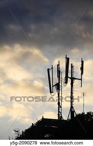 Stock Photo - mobile phone masts on rooftops in rome italy. Fotosearch