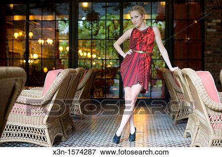 Model in dress with wicker furniture, Bowery Hotel, New York City View Large Photo Image Stock Photo - Model in dress with wicker furniture, Bowery Hotel, New York City. Fotosearch
