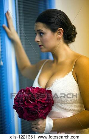 Model posing in white satin wedding gown View Large Photo Image Stock Image - Model posing in white satin wedding gown. Fotosearch