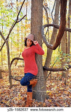 Model standing in forest by vines in autumn Memphis Tennessee USA. View Large Photo Image Stock Photo - Model standing in forest by vines in autumn Memphis Tennessee USA.. Fotosearch