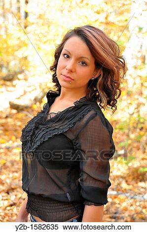 Model standing in forest in autumn Memphis Tennessee USA. View Large Photo Image Stock Photography - Model standing in forest in autumn Memphis Tennessee USA.. Fotosearch