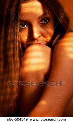 Model with chin on knee, glamour View Large Photo Image Stock Photo - Model with chin on knee, glamour. Fotosearch