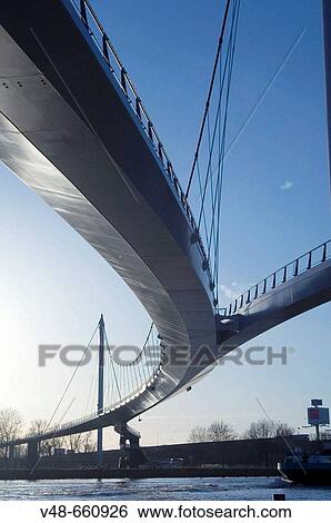 Modern bridge for cyclist and pedestrians to a new built part of Amsterdam, Ijburg. Netherlands, (January 2007) View Large Photo Image Stock Photograph - Modern bridge for cyclist and pedestrians to a new built part of Amsterdam, Ijburg. Netherlands, (January 2007). Fotosearch