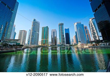 Modern high-rise apartment towers at Jumeirah Lakes Towers JLT at Dubai, UAE View Large Photo Image Stock Photo - Modern high-rise apartment towers at Jumeirah Lakes Towers JLT at Dubai, UAE. Fotosearch
