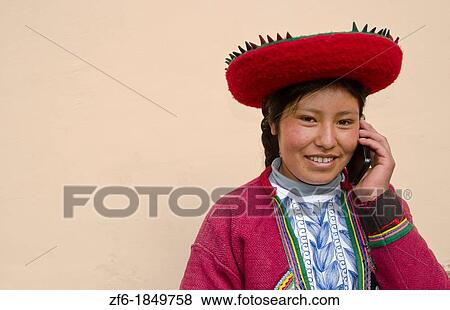 Modern life in Peru woman in traditional dress and hat with cell phone communicating via wireless View Large Photo Image Stock Photo - Modern life in Peru woman in traditional dress and hat with cell phone communicating via wireless. Fotosearch