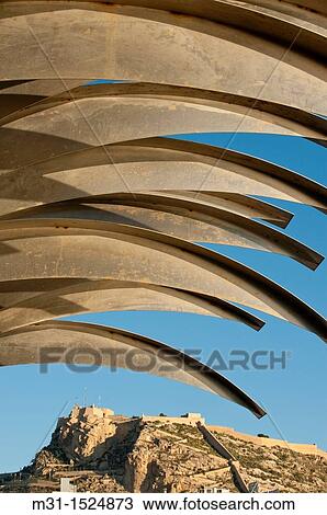 Modern sculpture at harbour promenade of Alicante and Santa Barbara Castle on background Alicante province, Valencian Community, Spain, Europe View Large Photo Image Stock Image - Modern sculpture at harbour promenade of Alicante and Santa Barbara Castle on background Alicante province, Valencian Community, Spain, Europe. Fotosearch