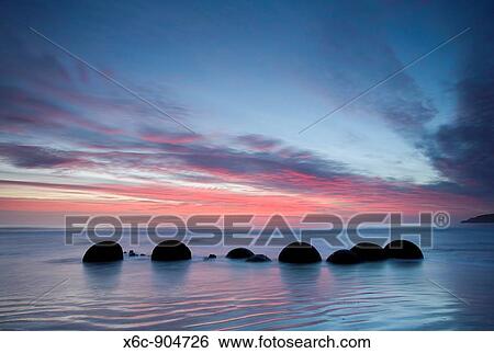 Stock Photograph - Moeraki Boulders at Dawn South Island New Zealand. Fotosearch