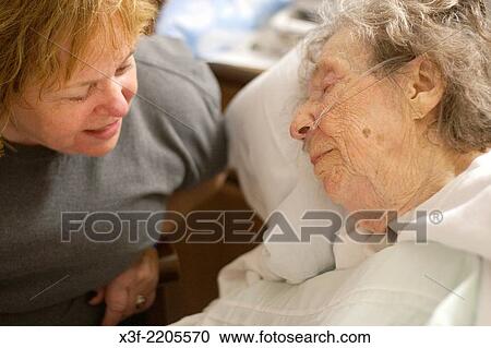 Stock Image - Mom 95 recuperating after taking a fall at her assisted living complex. Fergus Falls Minnesota MN USA.. Fotosearch