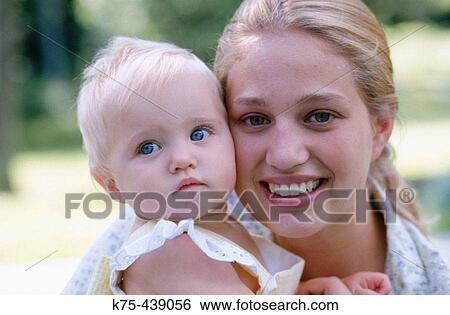 Mom and baby daughter View Large Photo Image Stock Photograph - Mom and baby daughter. Fotosearch