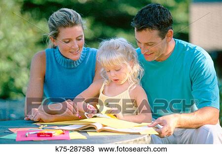 mom and dad doing crafts with their daughter View Large Photo Image Stock Image - mom and dad doing crafts with their daughter. Fotosearch