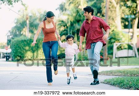 Mom and Dad running and holding up daughter View Large Photo Image Stock Image - Mom and Dad running and holding up daughter. Fotosearch