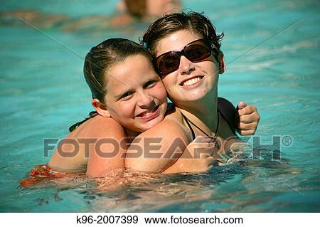 Stock Photo - Mom and daughter in a pool. Fotosearch