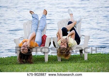 mom and daughter on cell phones View Large Photo Image Stock Photo - mom and daughter on cell phones. Fotosearch