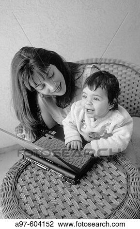 Mom and infant girl View Large Photo Image Stock Image - Mom and infant girl. Fotosearch