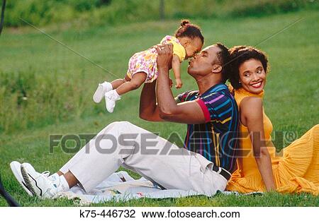 mom, dad, and 9 mon old baby View Large Photo Image Stock Image - mom, dad, and 9 mon old baby. Fotosearch