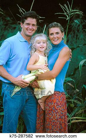 mom, dad, and daughter in a cornfield View Large Photo Image Stock Image - mom, dad, and daughter in a cornfield. Fotosearch