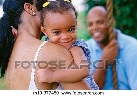 mom, dad, and smiling baby View Large Photo Image Stock Image - mom, dad, and smiling baby. Fotosearch