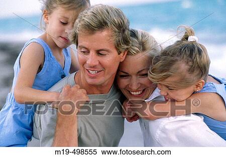 Mom & dad with twin girls at the beach View Large Photo Image Stock Photography - Mom & dad with twin girls at the beach. Fotosearch