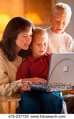 Mom, her two sons, and laptop View Large Photo Image Stock Image - Mom, her two sons, and laptop. Fotosearch