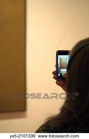 MOMA visitor taking a picture of Marilyn Monroe portrait by Andy Warhol with a mobile device. View Large Photo Image Stock Photo - MOMA visitor taking a picture of Marilyn Monroe portrait by Andy Warhol with a mobile device.. Fotosearch