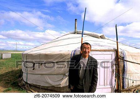 Mongolian Native by Ger in the Nomadic Country of Mongolia. View Large Photo Image Stock Photo - Mongolian Native by Ger in the Nomadic Country of Mongolia.. Fotosearch