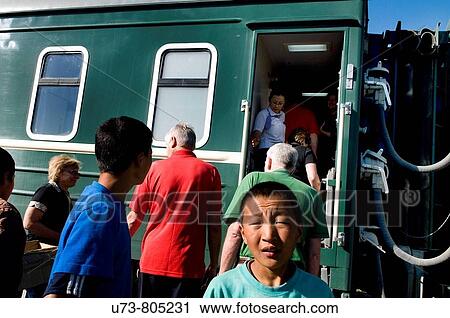 Stock Image - Mongolian tran stops at a small station in Mongolia. Fotosearch