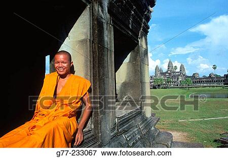 Monk at Angkor Wat Temple. Cambodia View Large Photo Image Stock Photo - Monk at Angkor Wat Temple. Cambodia. Fotosearch