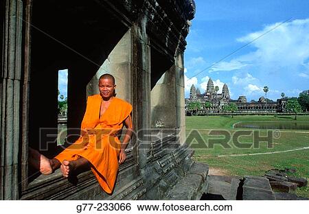 Monk at Angkor Wat Temple. Cambodia View Large Photo Image Stock Photograph - Monk at Angkor Wat Temple. Cambodia. Fotosearch