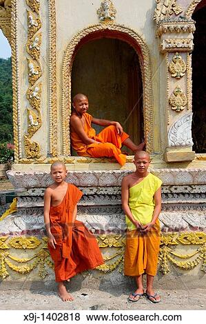 Monk in doorway, Luang Prabang, UNESCO World Heritage Site, Laos, Indochina View Large Photo Image Stock Photo - Monk in doorway, Luang Prabang, UNESCO World Heritage Site, Laos, Indochina. Fotosearch
