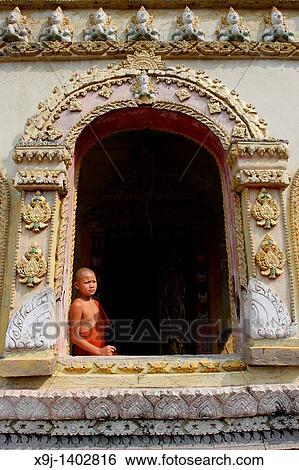 Monk in doorway, Luang Prabang, UNESCO World Heritage Site, Laos, Indochina View Large Photo Image Stock Photograph - Monk in doorway, Luang Prabang, UNESCO World Heritage Site, Laos, Indochina. Fotosearch