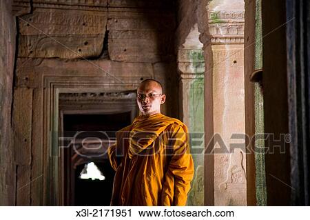 Monk in Temples of Bayon. Angkor site. Cambodia. View Large Photo Image Stock Image - Monk in Temples of Bayon. Angkor site. Cambodia.. Fotosearch